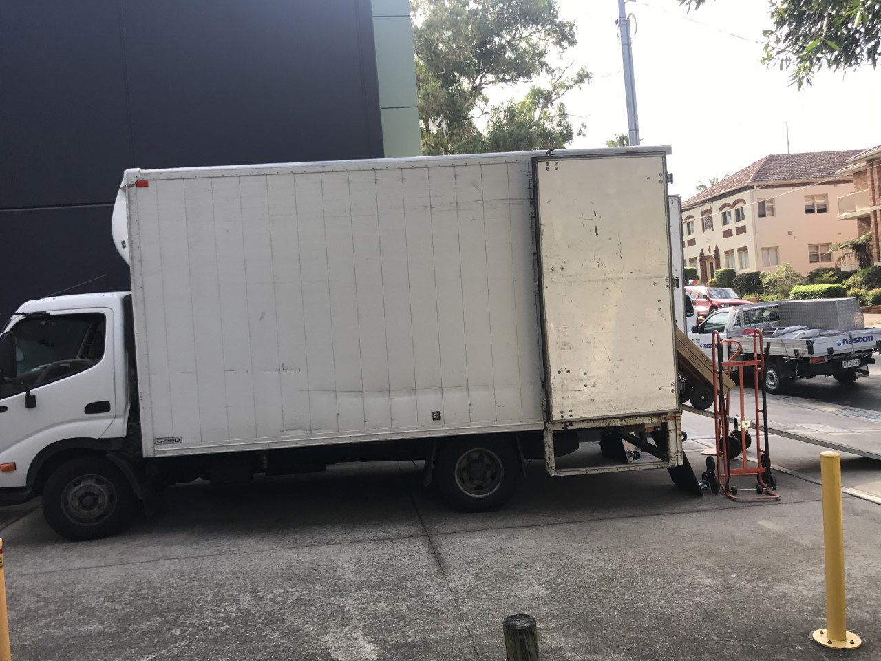 Sydney Move2Go removal truck parked on a Sydney street with a hydraulic tail lift